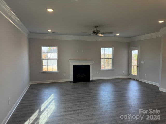 unfurnished living room with dark hardwood / wood-style flooring, ceiling fan, and crown molding