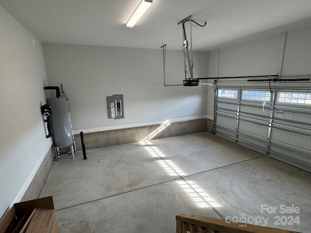 garage with electric panel, water heater, and a garage door opener