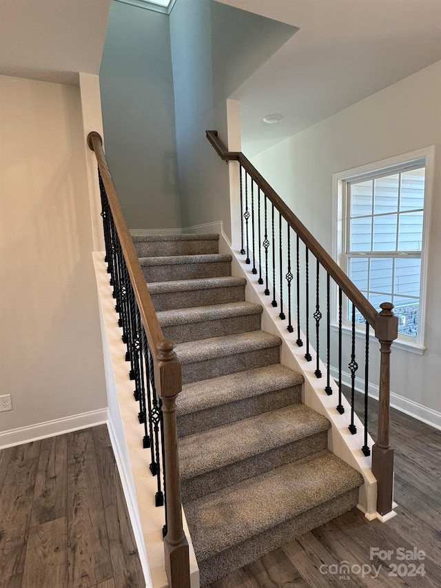 stairs with wood-type flooring