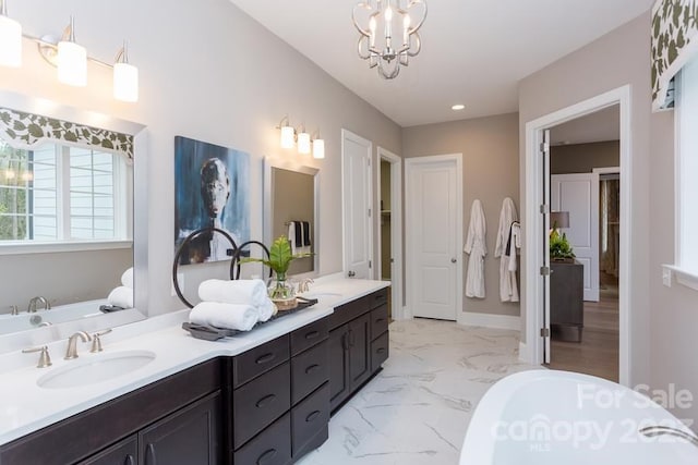 bathroom with a notable chandelier, a bathing tub, dual sinks, tile flooring, and oversized vanity