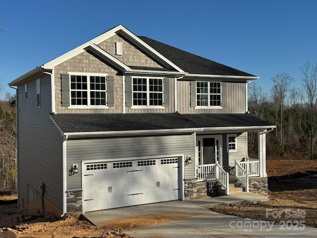 craftsman house with covered porch and a garage