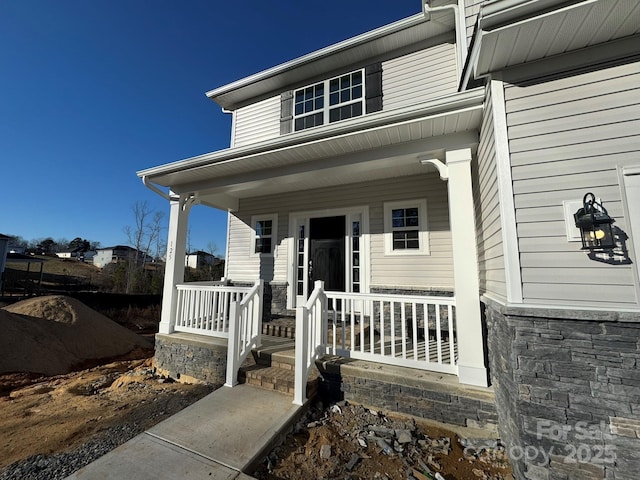 property entrance featuring covered porch