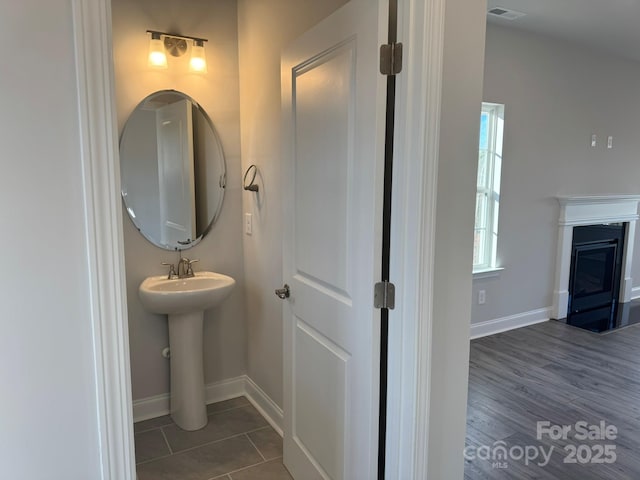 bathroom with tile patterned floors and sink