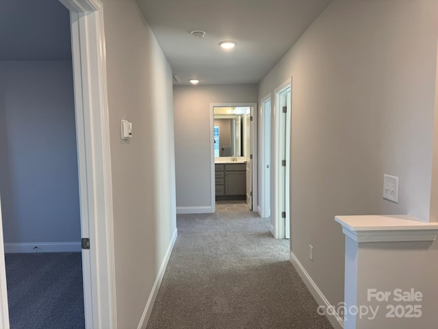 corridor with carpet flooring