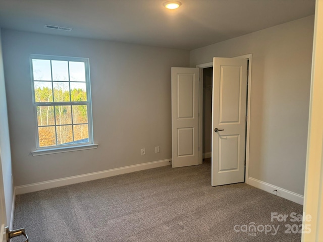 unfurnished bedroom with carpet