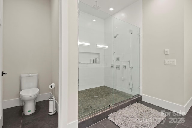 bathroom featuring toilet, tile patterned flooring, and a shower with door