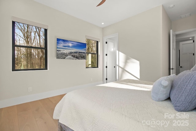 bedroom featuring ceiling fan and hardwood / wood-style floors