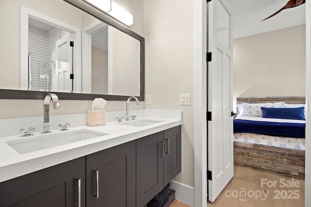 bathroom featuring vanity and hardwood / wood-style floors