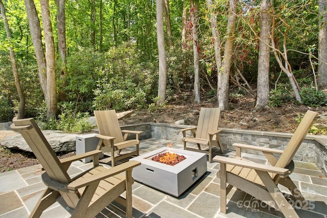 view of patio / terrace with a fire pit