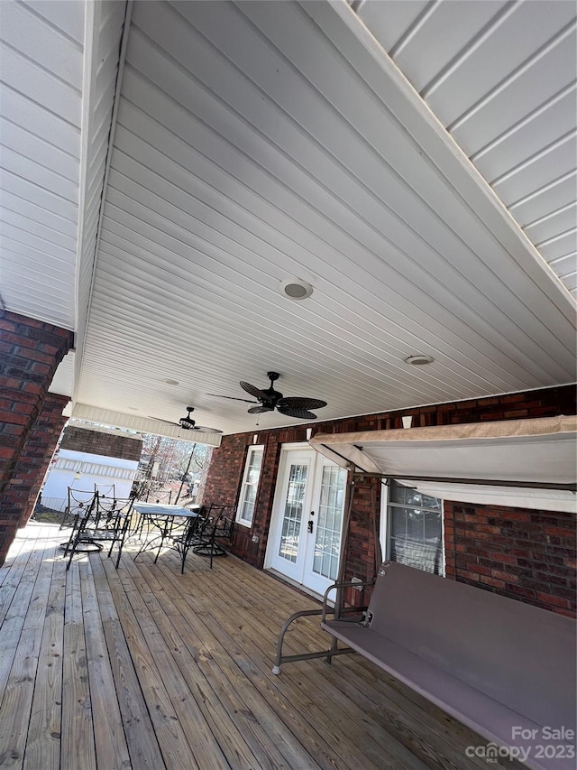 deck featuring french doors and ceiling fan