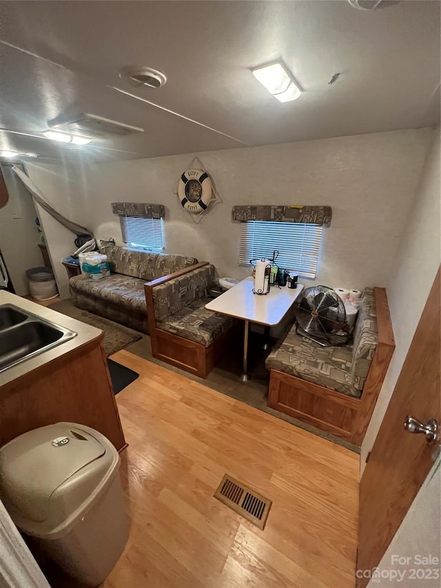 interior space featuring light hardwood / wood-style floors and sink