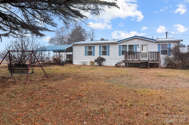 rear view of property with a yard