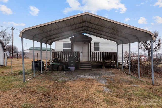 view of front of home with a carport