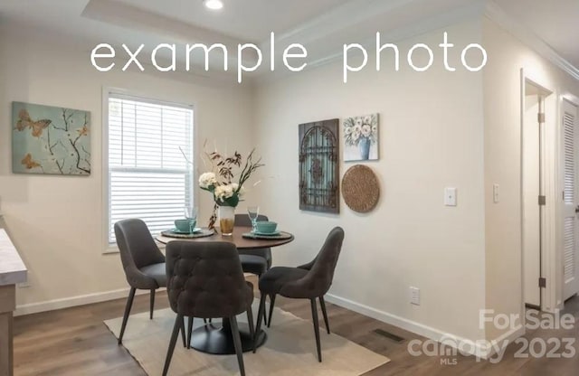 dining room with hardwood / wood-style flooring