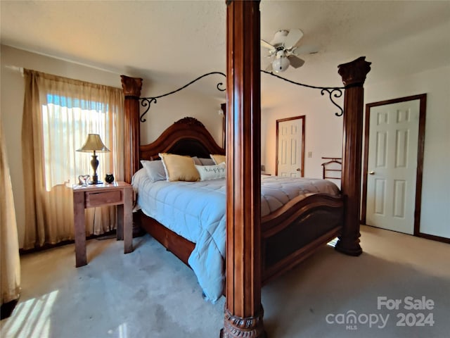 carpeted bedroom featuring ceiling fan