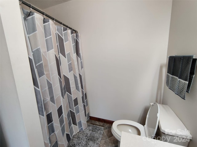 bathroom featuring tile patterned floors and toilet