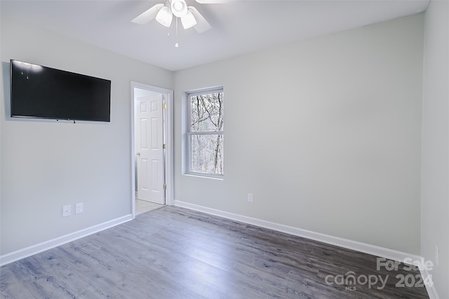 empty room featuring light hardwood / wood-style flooring and ceiling fan