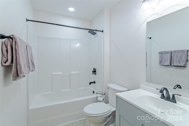 full bathroom featuring  shower combination, vanity, and toilet