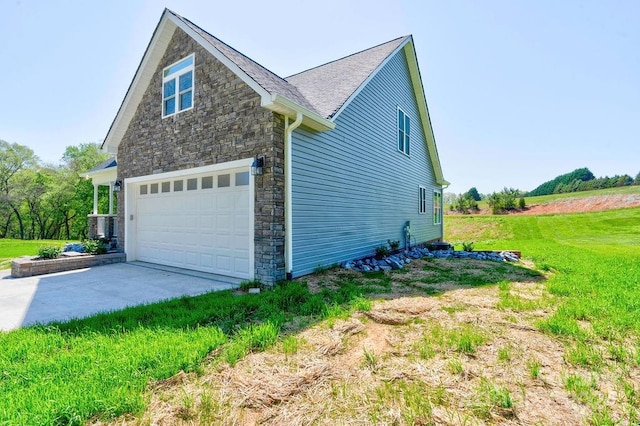 view of property exterior featuring a garage and a lawn