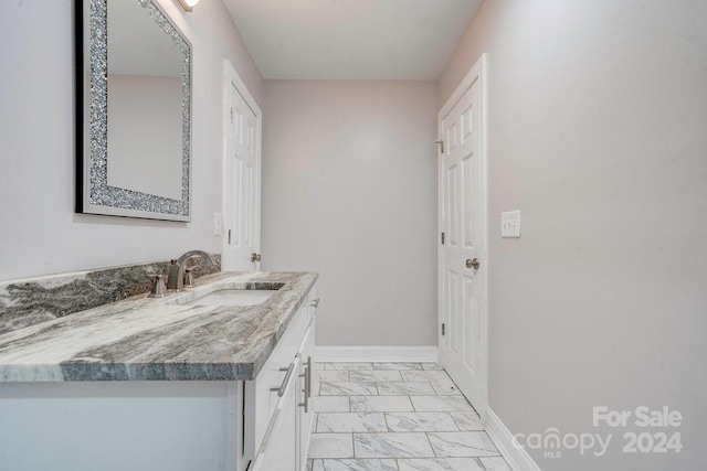 bathroom featuring vanity and tile floors