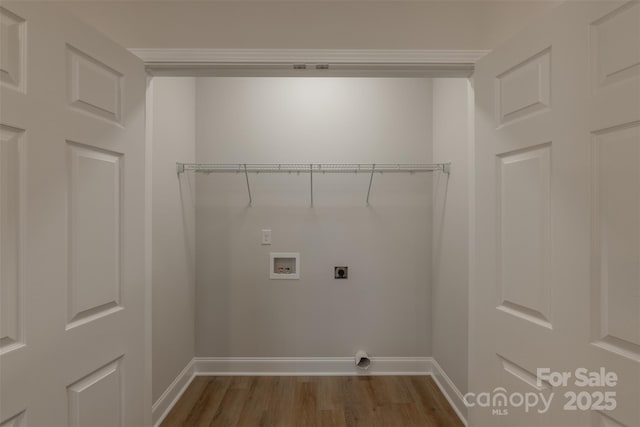 washroom featuring hookup for an electric dryer, hookup for a washing machine, and wood-type flooring