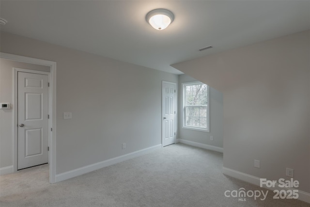 additional living space with light carpet