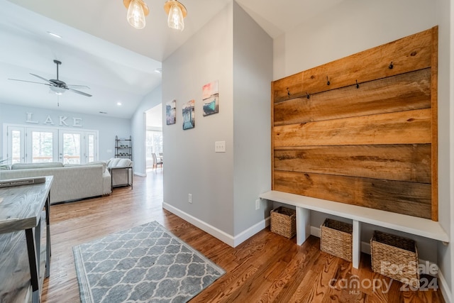 mudroom with ceiling fan, vaulted ceiling, light hardwood / wood-style floors, and french doors