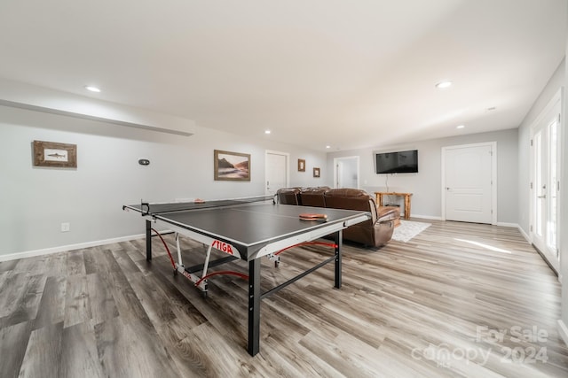 recreation room with light wood-type flooring