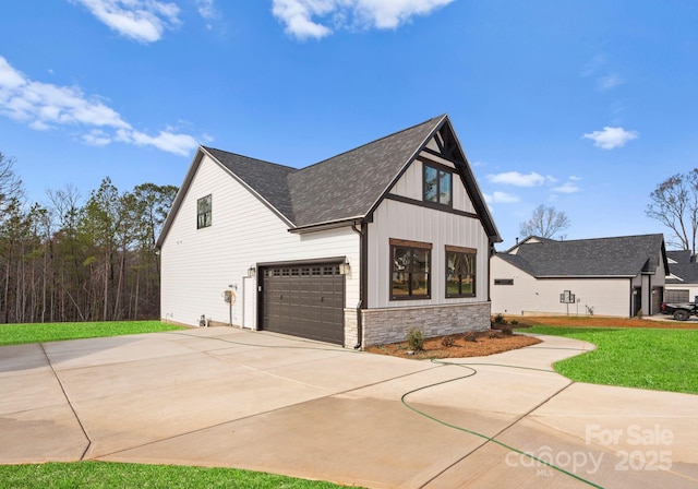 view of property exterior with a lawn and a garage