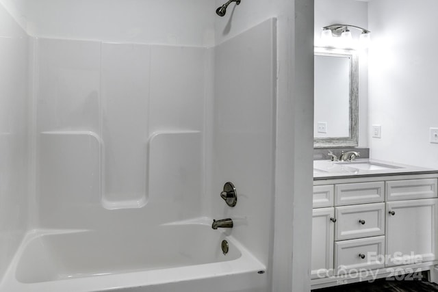 bathroom featuring vanity and shower / washtub combination