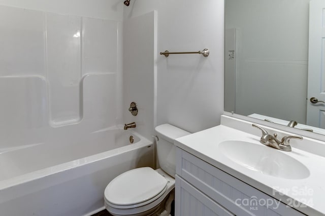 full bathroom with washtub / shower combination, toilet, and vanity