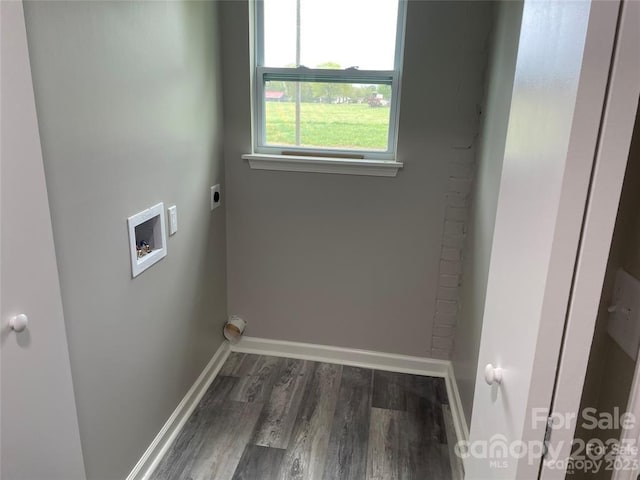 clothes washing area featuring electric dryer hookup, dark wood-type flooring, and hookup for a washing machine