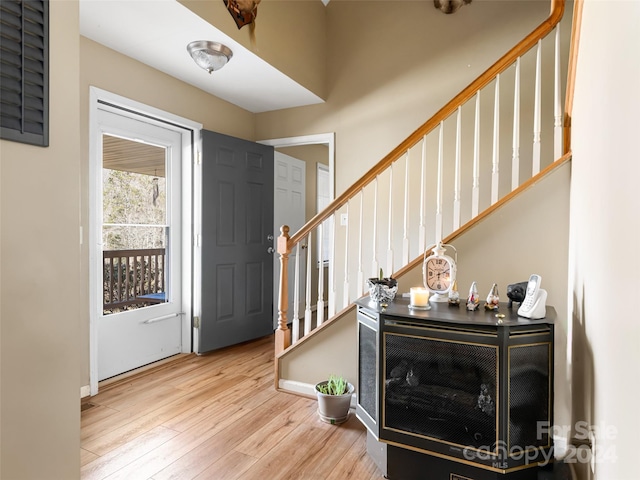 foyer entrance with light hardwood / wood-style floors