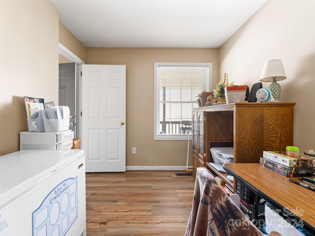 home office featuring light hardwood / wood-style flooring