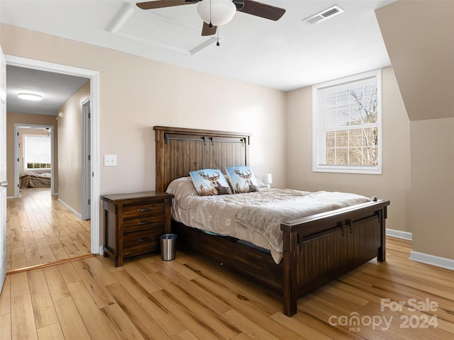 bedroom with ceiling fan and light wood-type flooring