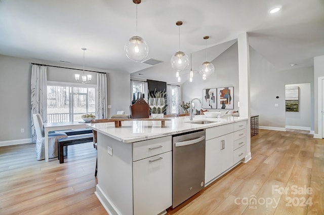 kitchen featuring stainless steel dishwasher, decorative light fixtures, and white cabinetry