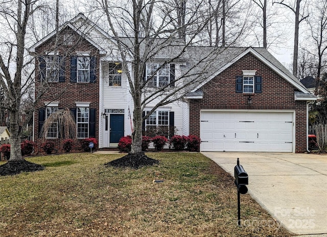 view of front property with a garage and a front yard