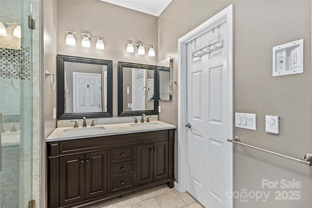 bathroom featuring walk in shower, tile patterned floors, and vanity