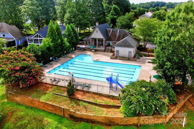 view of swimming pool with a patio area