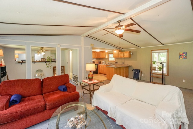 carpeted bedroom with ceiling fan and vaulted ceiling with beams