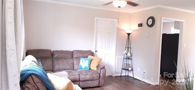 living room with hardwood / wood-style floors, ceiling fan, and crown molding