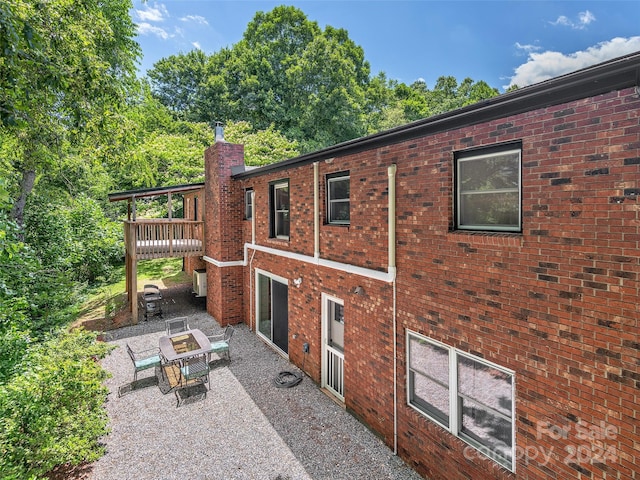 view of side of property featuring a patio area