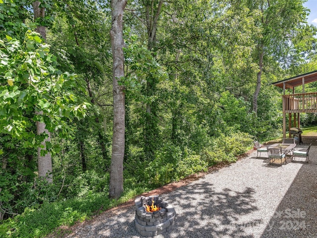 view of yard featuring a patio area and a fire pit