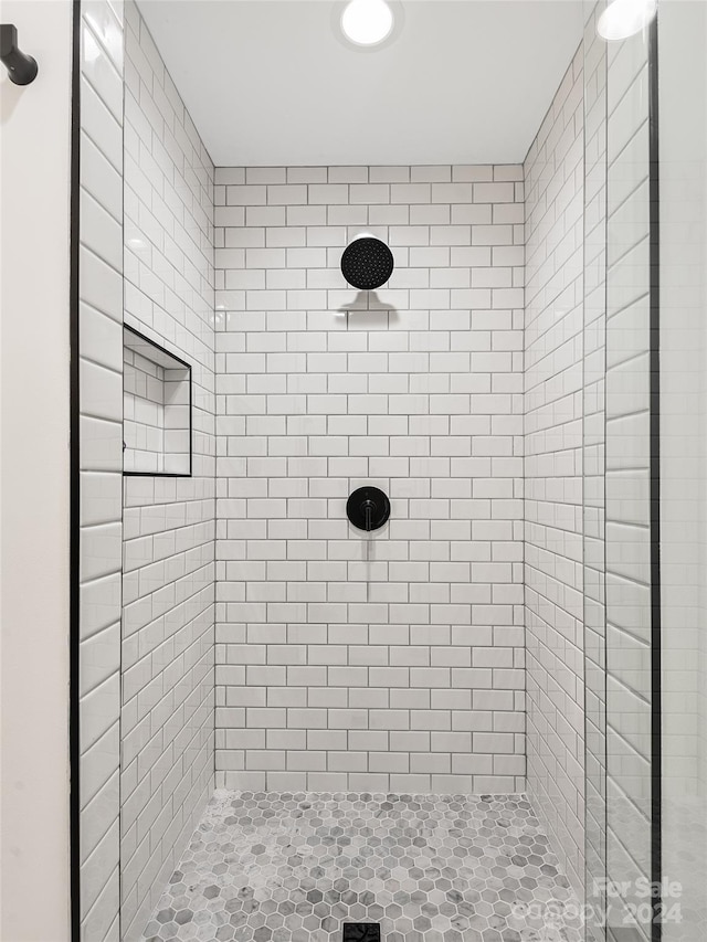 bathroom with a tile shower