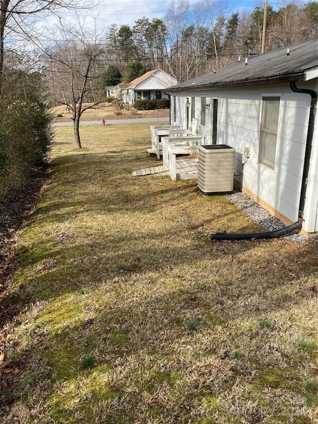 view of yard featuring central AC unit