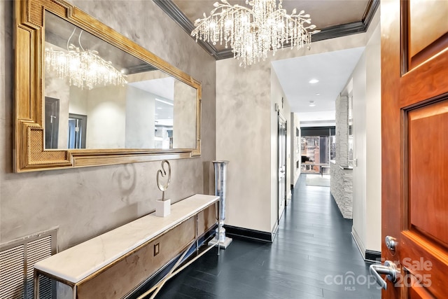 hallway with dark wood-type flooring and ornamental molding