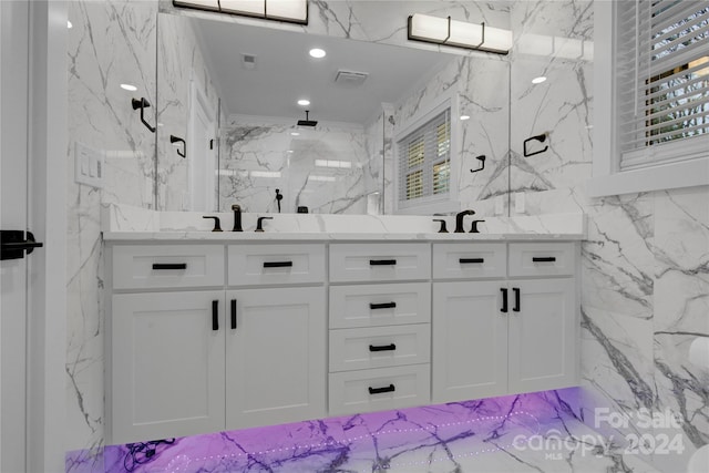 bathroom featuring walk in shower, tile walls, tile flooring, and double vanity