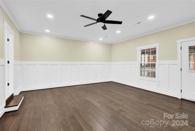 unfurnished room featuring ornamental molding, ceiling fan, and dark hardwood / wood-style floors