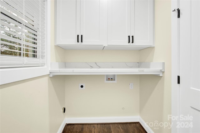 laundry room with washer hookup, cabinets, hookup for an electric dryer, and dark wood-type flooring