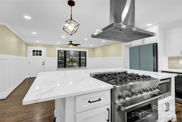 kitchen with dark hardwood / wood-style floors, ceiling fan, high end appliances, light stone counters, and island exhaust hood